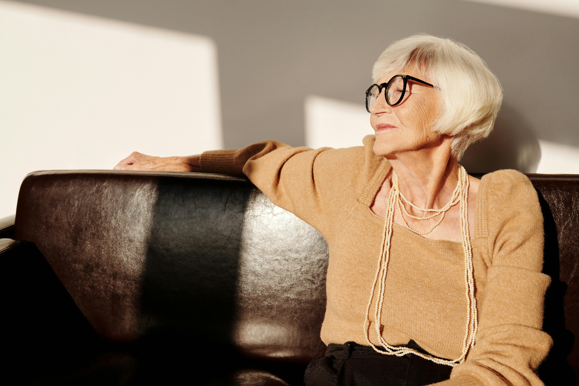 A woman settled at home in warm natural light